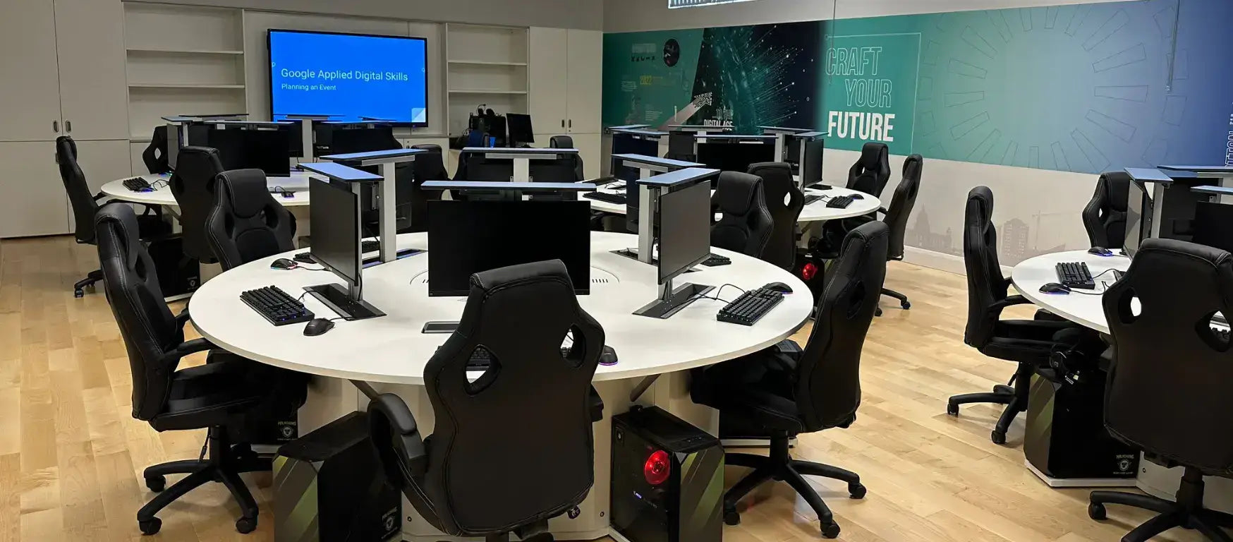 Modern esports lab at St Malachy's College featuring computers and ergonomic chairs, designed for creative education.