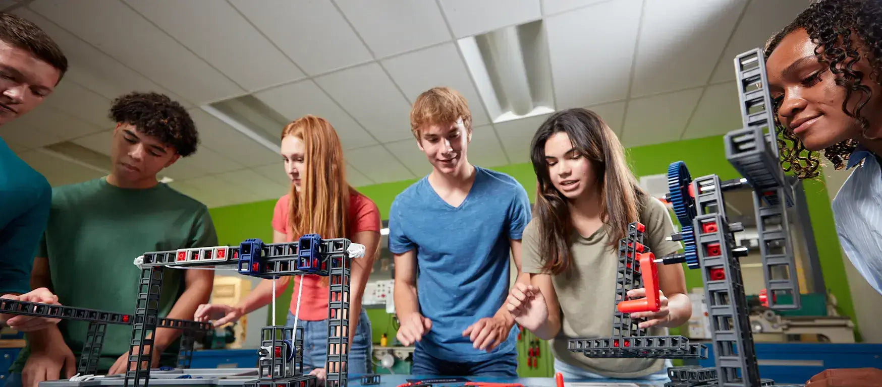 Students collaborating with Sphero Blueprint Build Kit in a classroom, engaged in hands-on engineering activities.