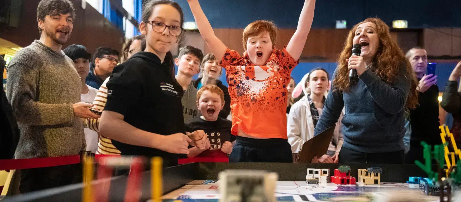 Excited participants celebrating at the FIRST® LEGO® League England & Wales final in Harrogate.