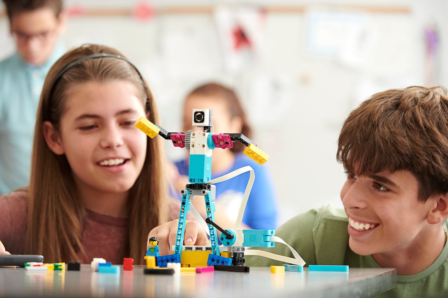 A student engages with a LEGO Education Secondary model car in a classroom setting, promoting hands-on learning.