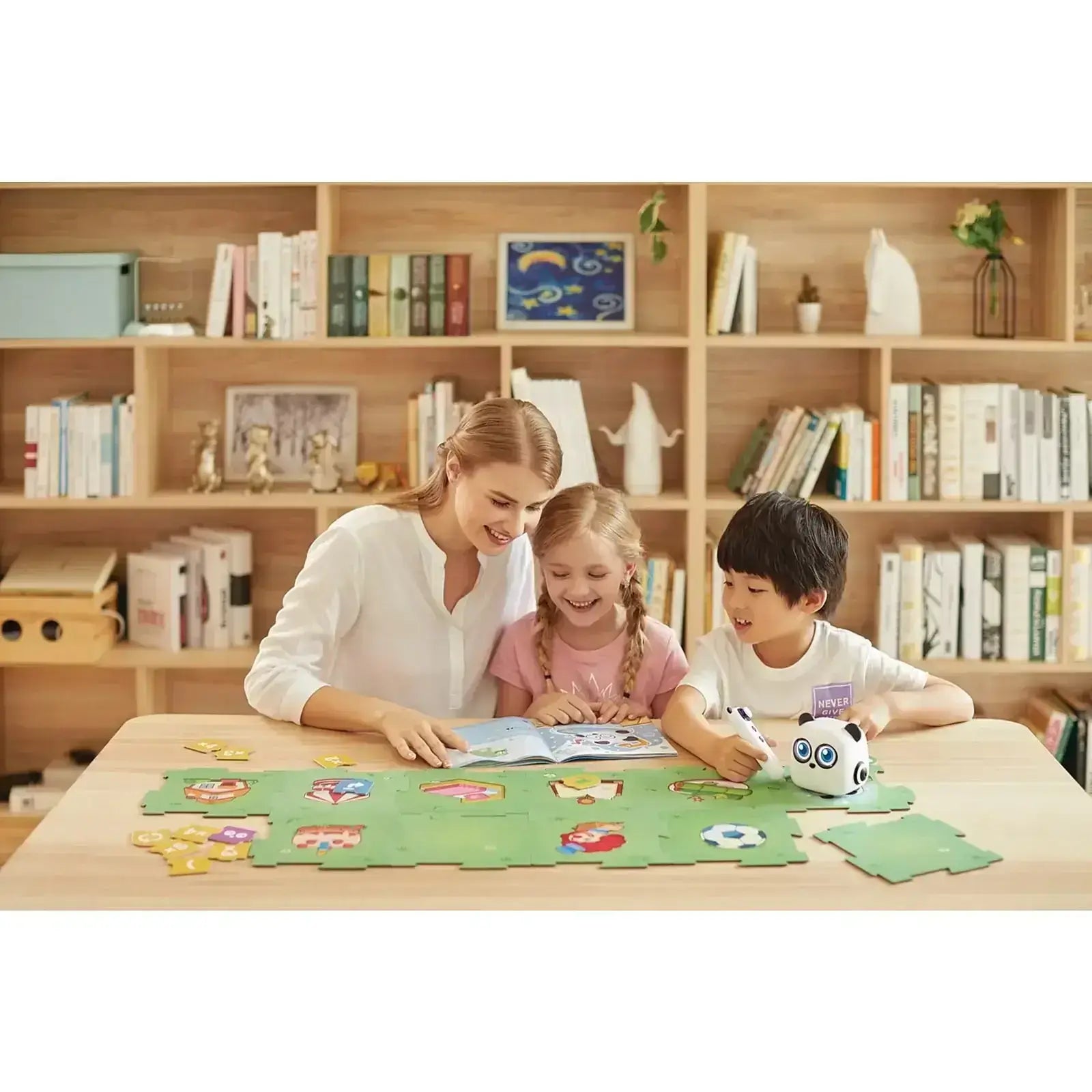 Children and parent enjoying a puzzle together on a wooden table, with bookshelves in the background.