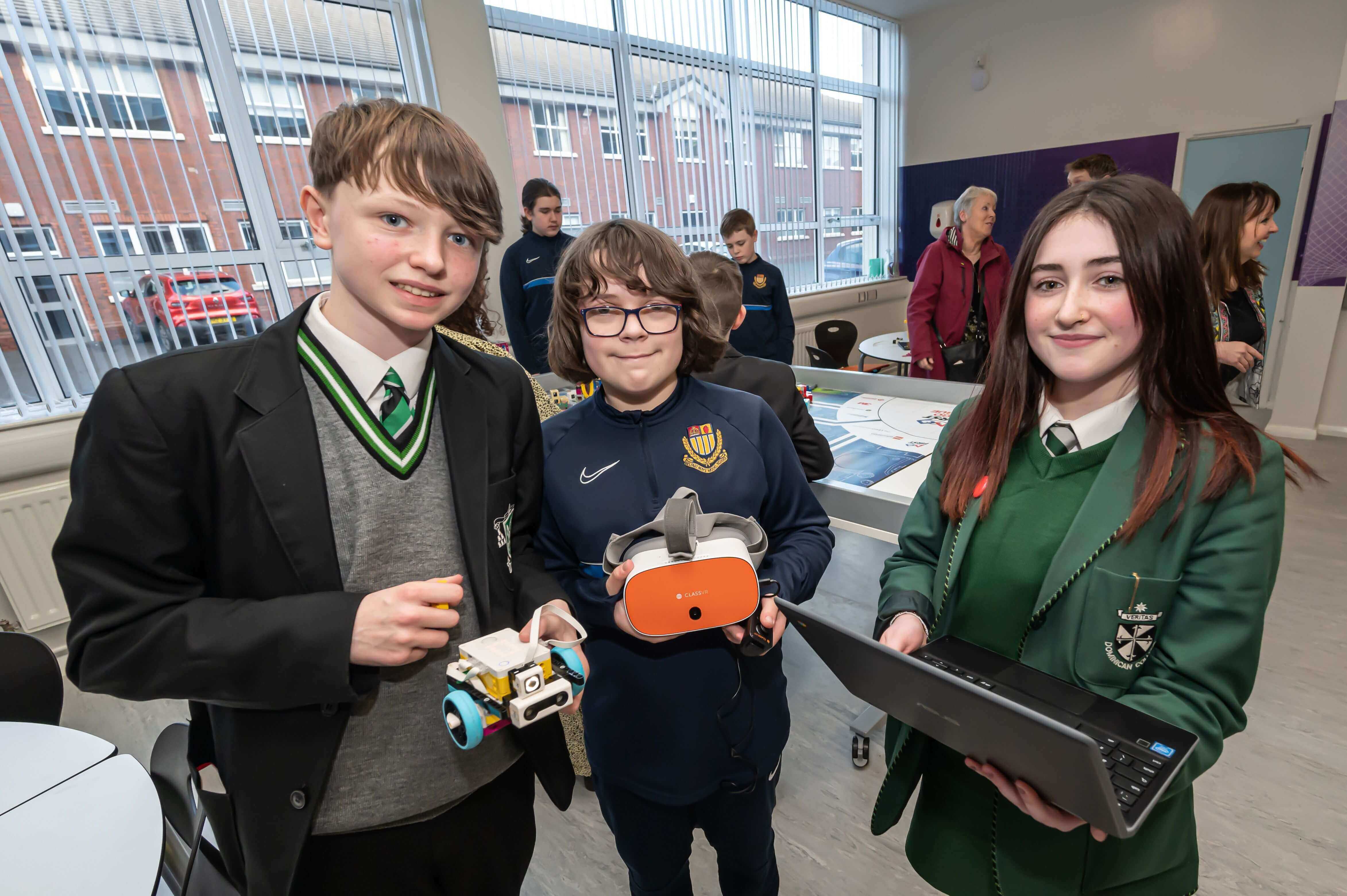 Students showcase robotics projects at school event, demonstrating creativity and teamwork.