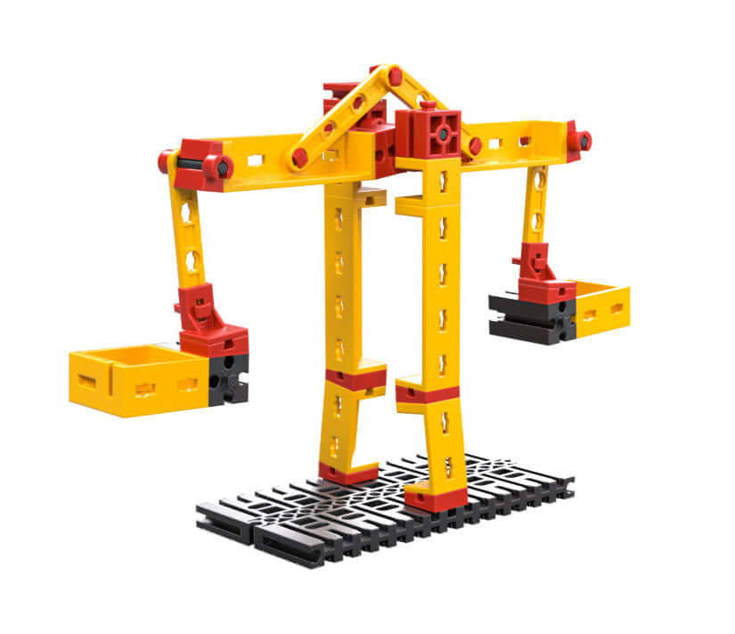 Colorful construction crane model showcasing basics of physics and technology for primary school students.