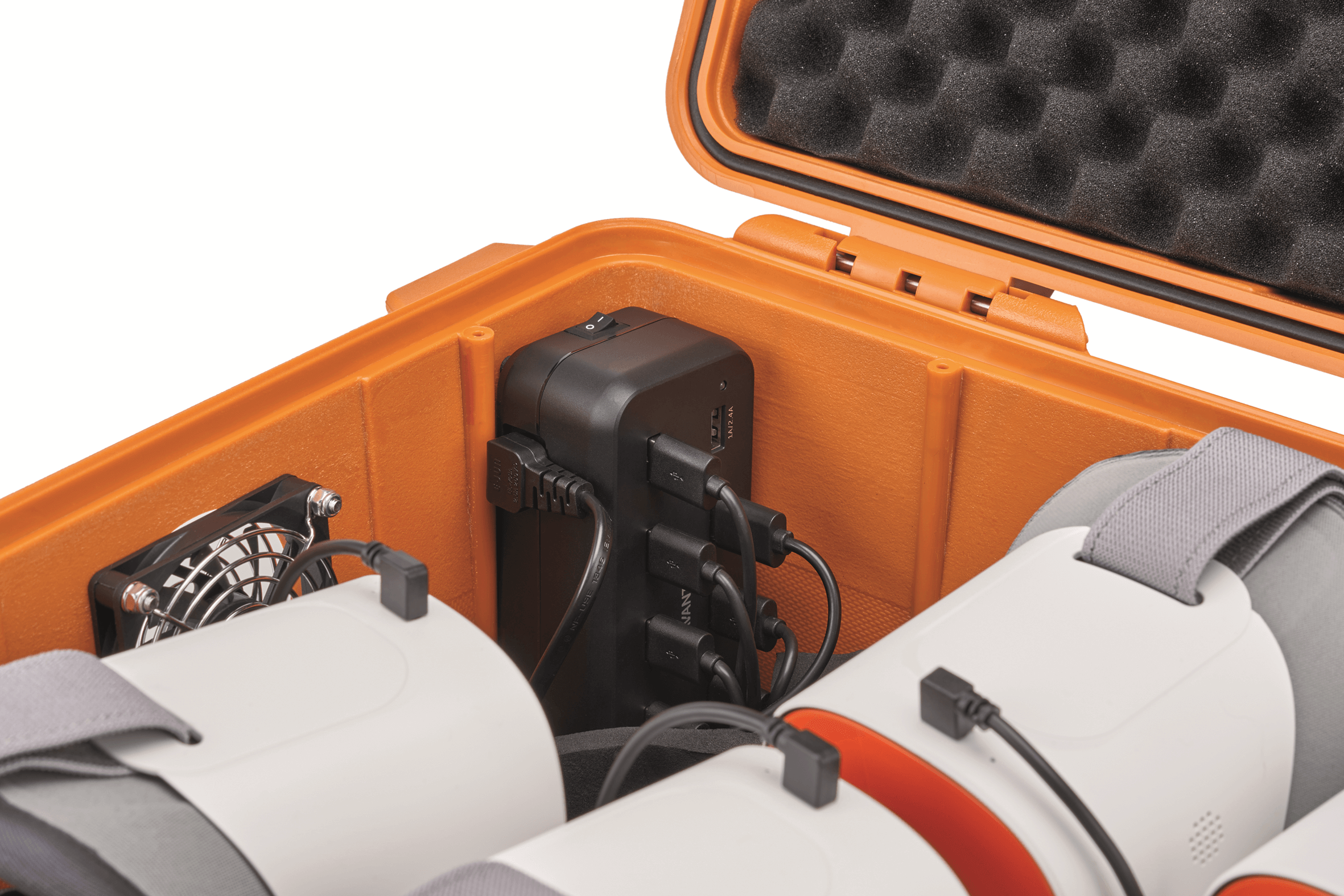 Interior of ClassVR carrying case featuring charging device and VR headsets.