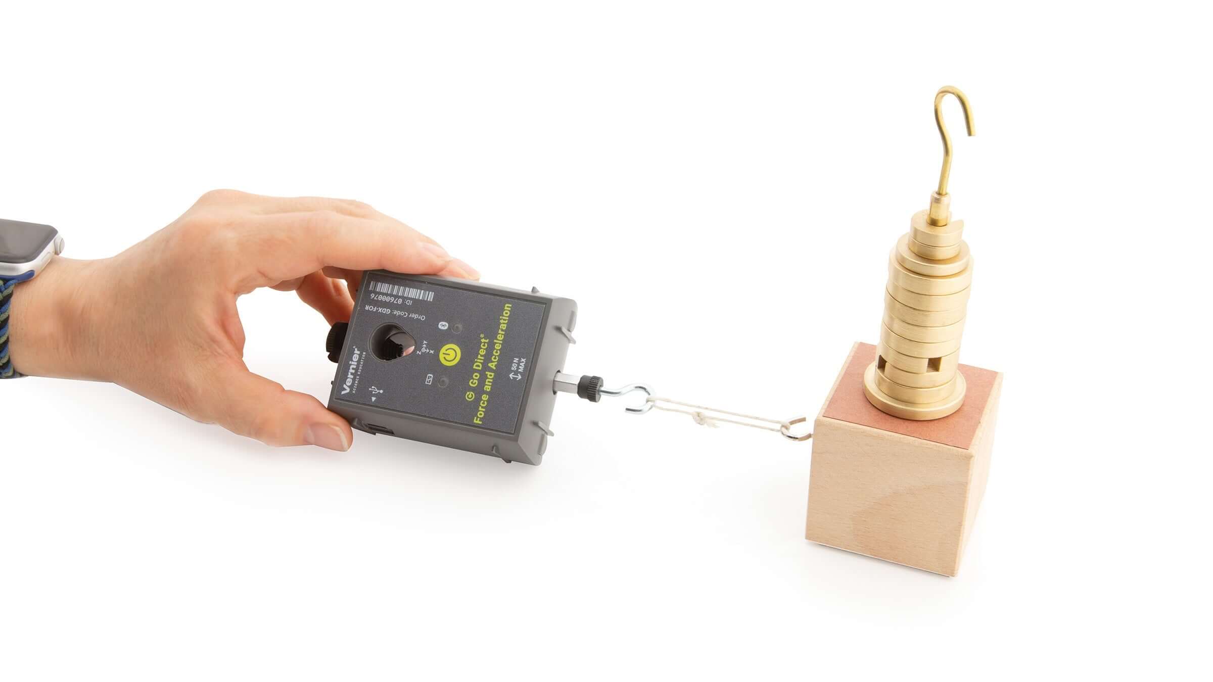 Go Direct Force and Acceleration Sensor measuring force with a hook and weights in a classroom setup.