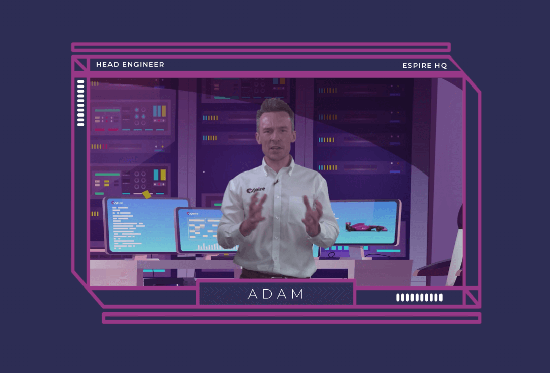 Head Engineer Adam presenting at Espire HQ, with advanced tech screens in the background, explaining STEM concepts.