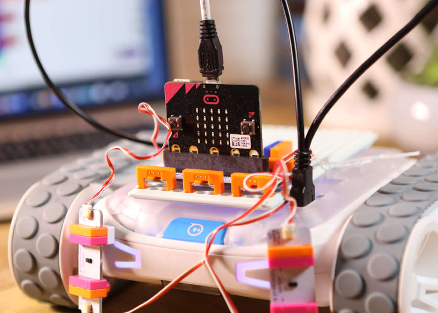 Close-up of Sphero RVR with littleBits Topper Kit, showcasing connection wires and electronic components for invention building.