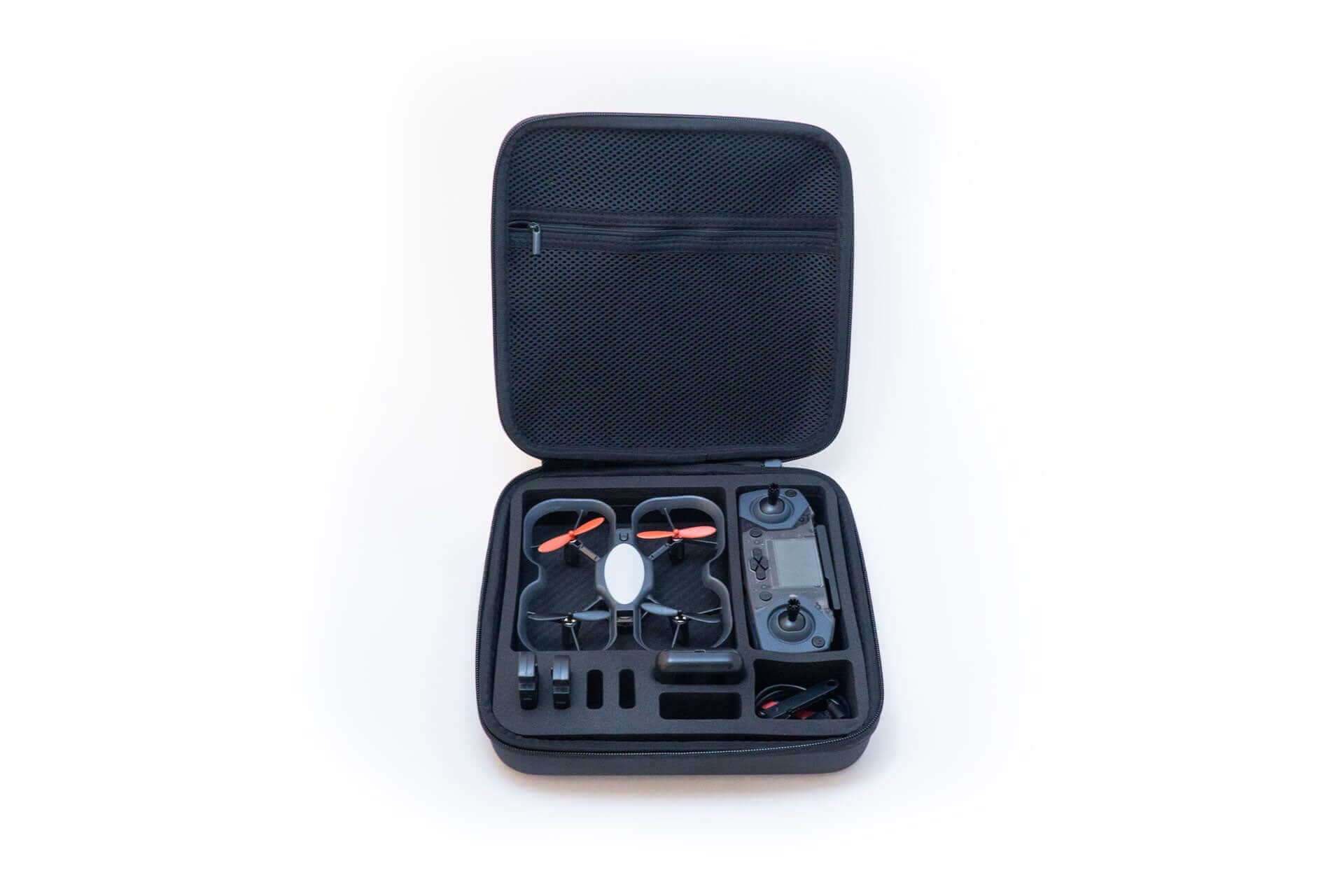 Open Robolink CoDrone EDU carrying case showcasing drone, controller, batteries, and accessories neatly organized.