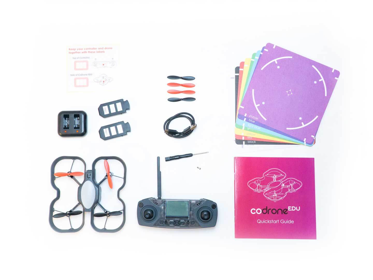 Robolink CoDrone EDU kit including drone, controller, propellers, batteries, and quickstart guide for programming.