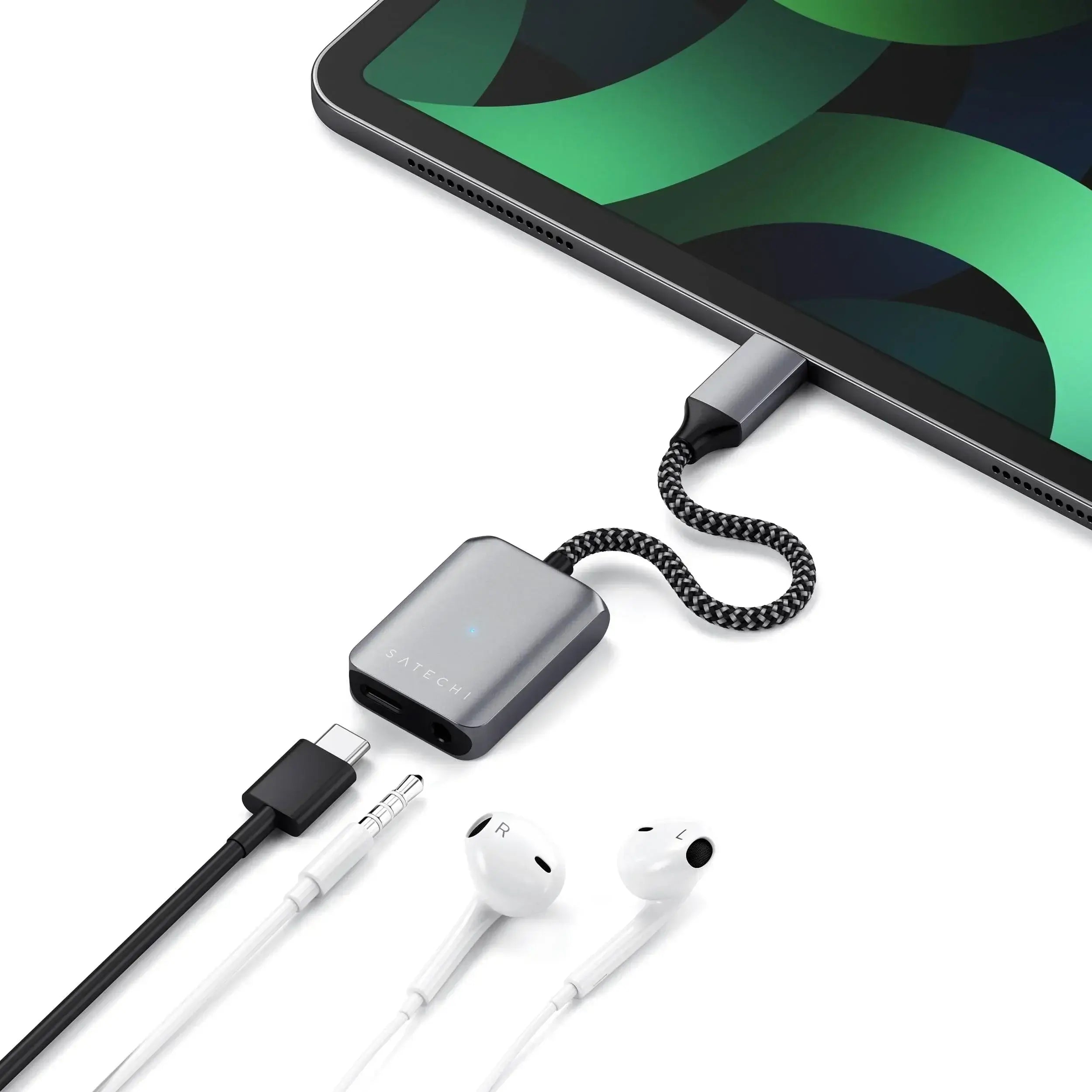 Satechi USB-C to 3.5mm Audio Adapter connected to tablet with headphones, showcasing sleek design and PD charging.