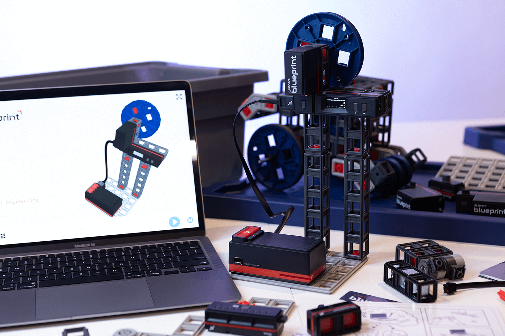 Sphero Blueprint Engineering Class Pack with kits, accessories, and laptop displaying engineering design tools.