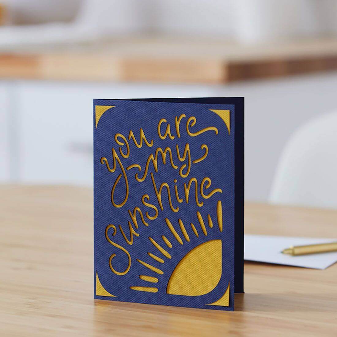 Cricut Joy greeting card featuring 'You are my sunshine' in navy and mustard, perfect for personalized messages.