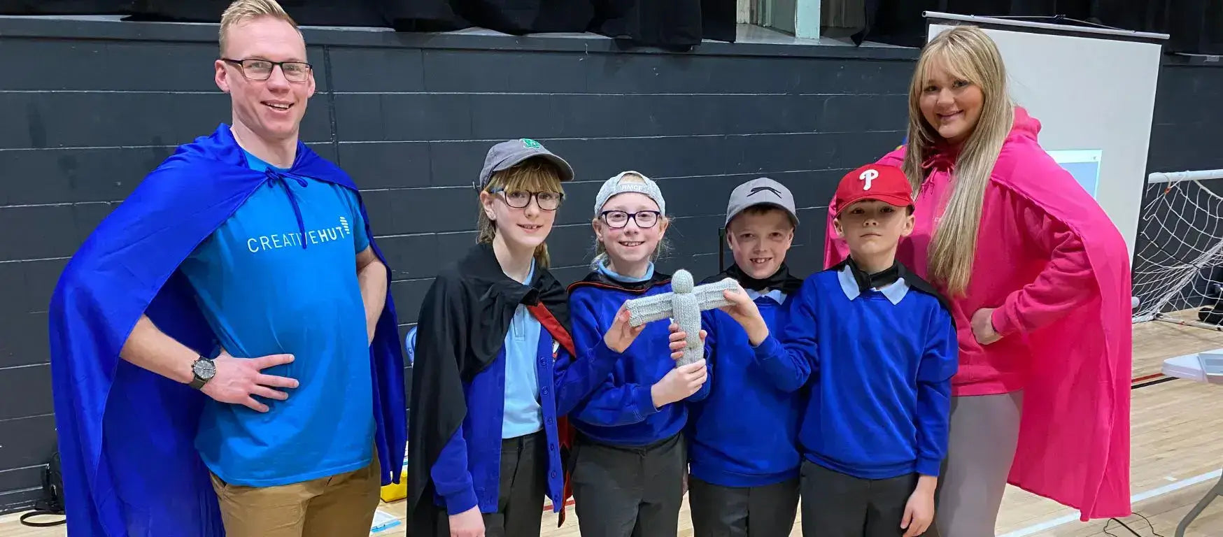 Students in capes celebrate at the FIRST® LEGO® League regionals event hosted by Nissan Skills Foundation.