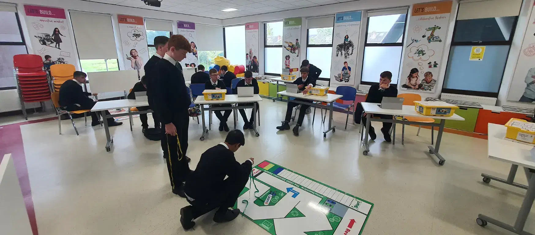 Students participating in an interactive educational workshop at CreativeHUT Ireland, engaging with creative learning activities.