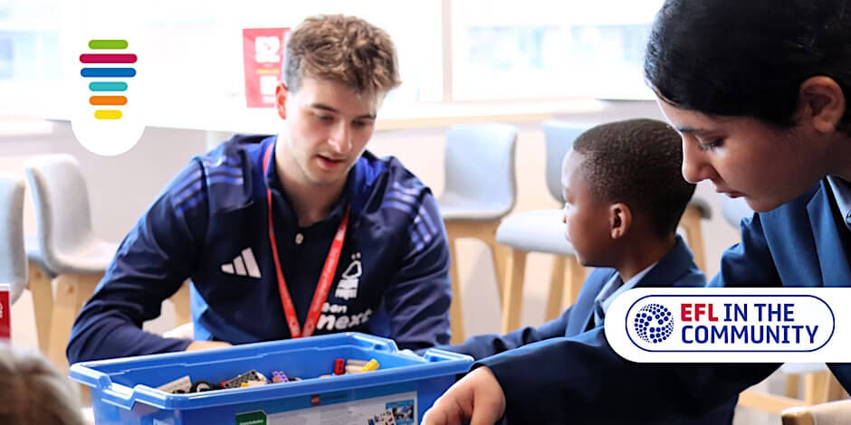 A young adult engaging with children in a classroom, promoting STEM education through hands-on activities.