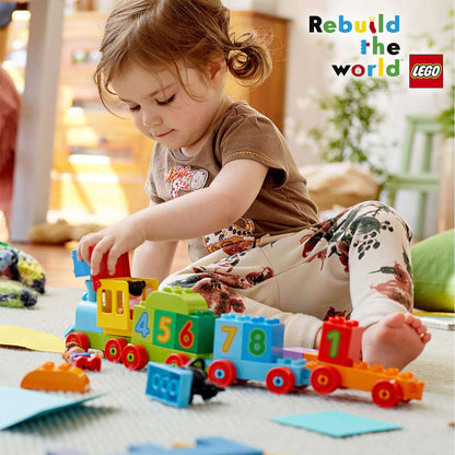 Child playing with LEGO® DUPLO Number Train Set 10847, learning numbers and counting skills in a fun environment.