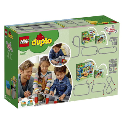 LEGO DUPLO Town Train Bridge and Tracks Set 10872, featuring children playing with colorful building blocks.