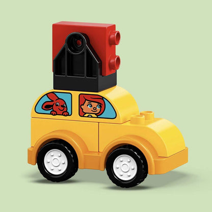 LEGO® DUPLO My First Car Creations yellow toy car with character and red block on top, ideal for toddler pretend play.