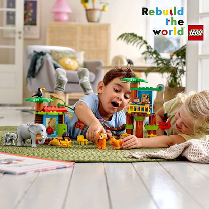 Children playing with LEGO® DUPLO Town Tropical Island Set 10906, featuring jungle animals and a tree house.