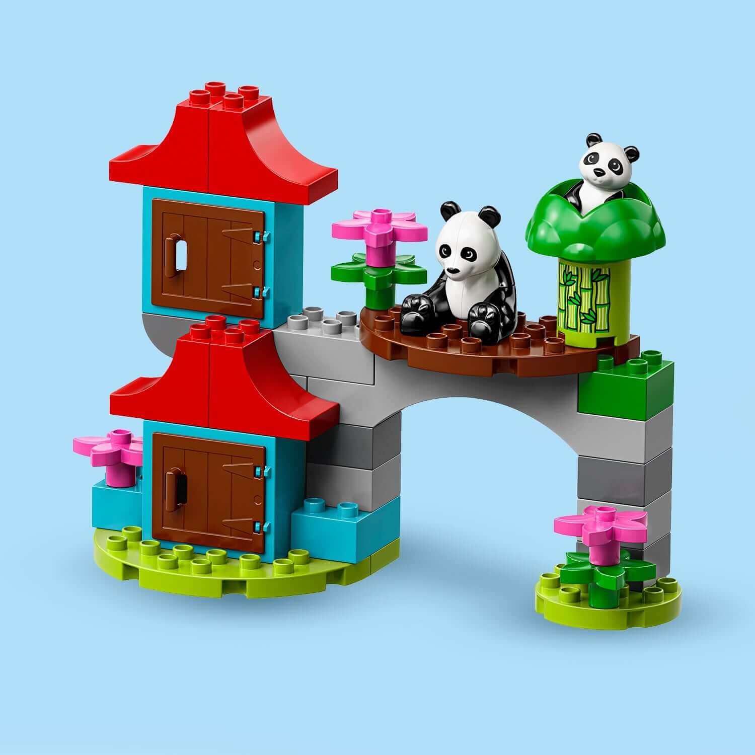 LEGO® DUPLO Town World Animals 10907 featuring buildable panda habitat with two panda figures and colorful accessories.