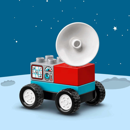 LEGO® DUPLO Space Shuttle Mission set featuring a colorful space vehicle with satellite dish on a lunar surface background.