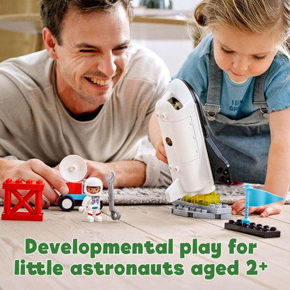 Father and child playing with LEGO® DUPLO Space Shuttle Mission Set, fostering developmental skills for toddlers 2+.