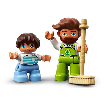 Two LEGO DUPLO figures, a child and an adult with a broom, promoting recycling play with the Garbage Truck & Recycling Toy.