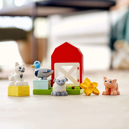 LEGO DUPLO Town Farm Animal Care set with pig, sheep, duck, cat, and barn, perfect for toddler imaginative play.