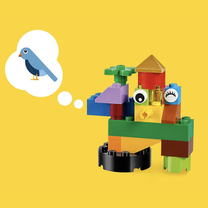 Colorful LEGO® Classic Basic Brick Set creation resembling a bird with thought bubble on yellow background.