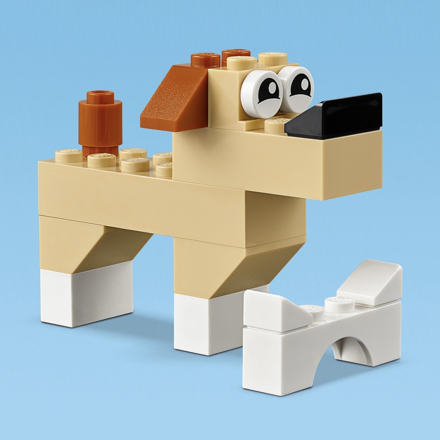 LEGO® Classic Basic Brick Set building toy featuring a cute dog figure and a white bone.