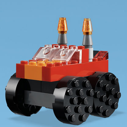LEGO Classic Basic Brick Set toy vehicle in vibrant red and black, featuring unique wheels and antennas.