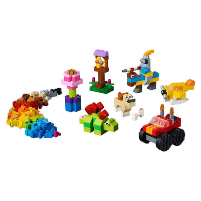 LEGO® Classic Basic Brick Set 11002 featuring colorful creations like animals, flowers, and vehicles for imaginative play.