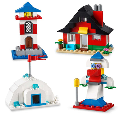 LEGO® Classic 4+ Bricks and Houses Set 11008 featuring a lighthouse, house, igloo, and creative figure.