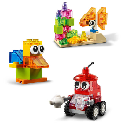 Colorful LEGO® creations including a duck, fish, and robot made with transparent bricks for imaginative play.