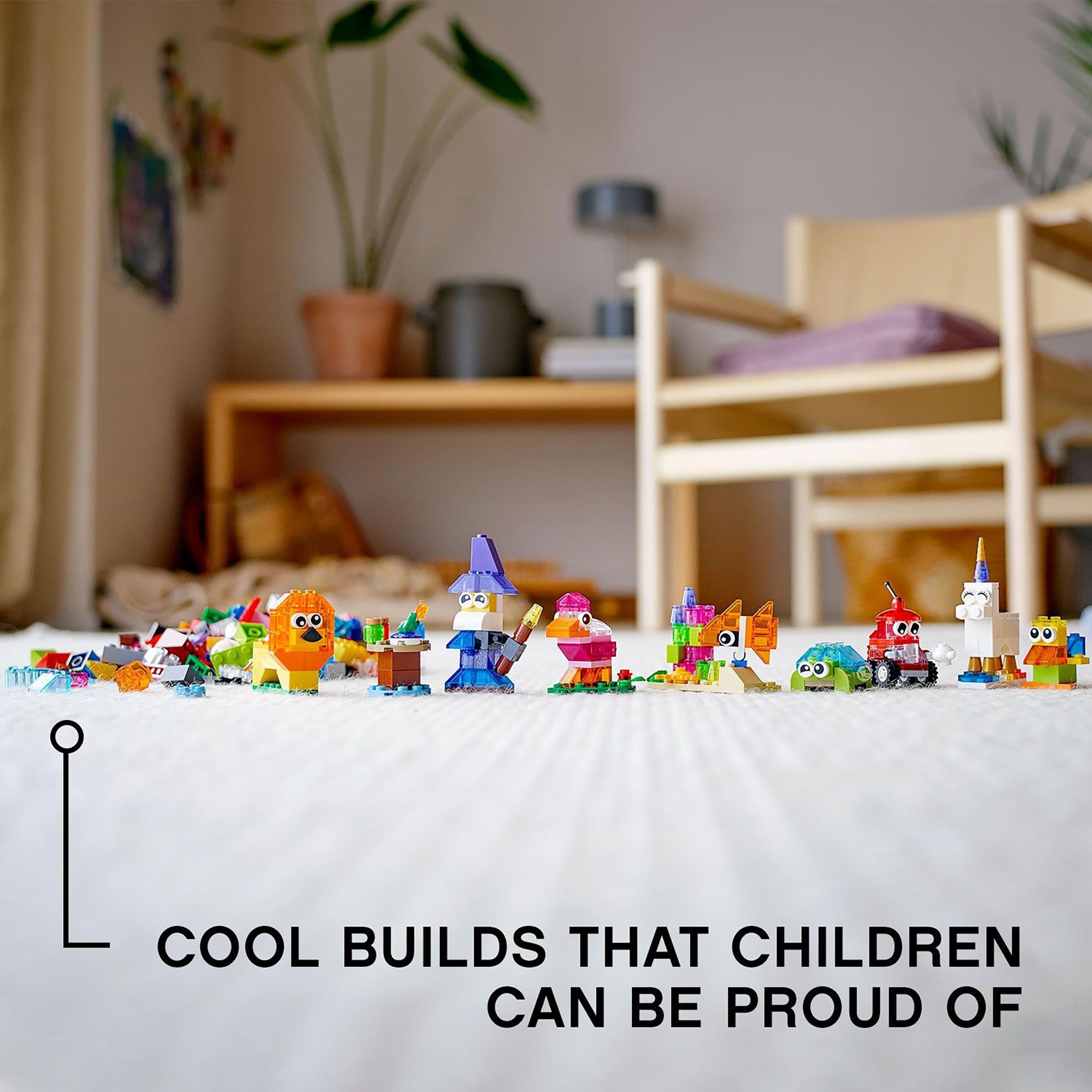 Colorful LEGO® models built by kids, showcasing creativity and fun with transparent bricks from the LEGO® Classic set 11013.