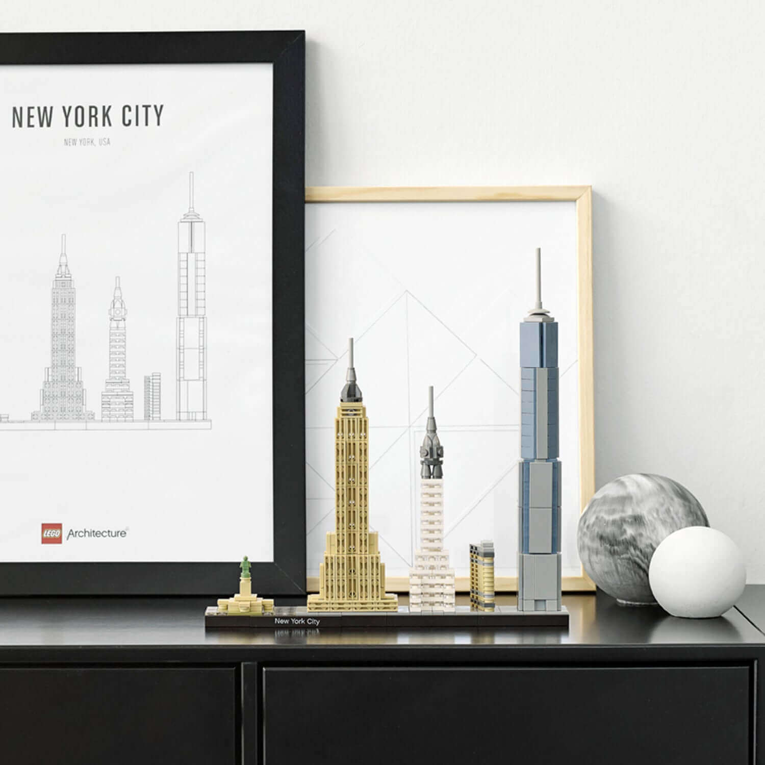 LEGO Architecture New York City skyline set featuring iconic buildings on display with framed art.