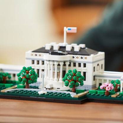 LEGO® Architecture The White House Building Set 21054 displayed with green trees and flag in detail.
