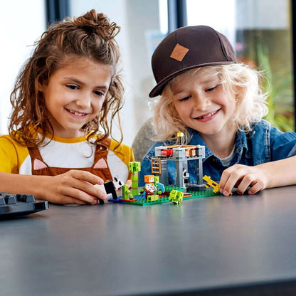 Kids playing with LEGO® Minecraft The Panda Nursery Building Set 21158, featuring pandas and nursery fun.