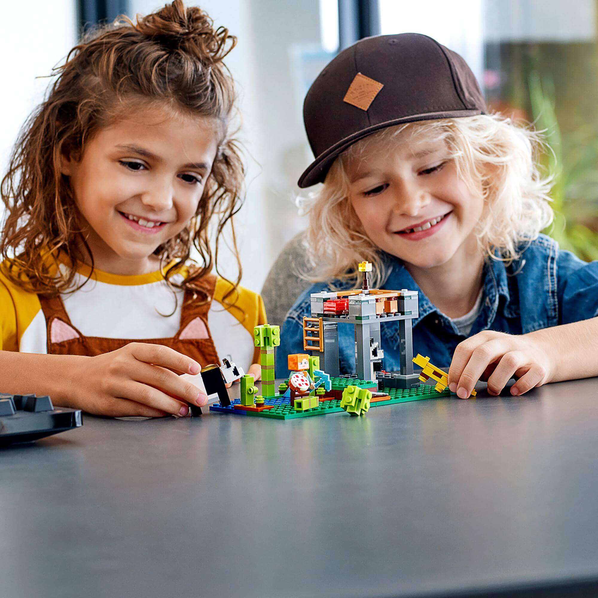 Kids enjoying hands-on play with LEGO® Minecraft The Panda Nursery Building Set 21158, featuring cute pandas and playful action.