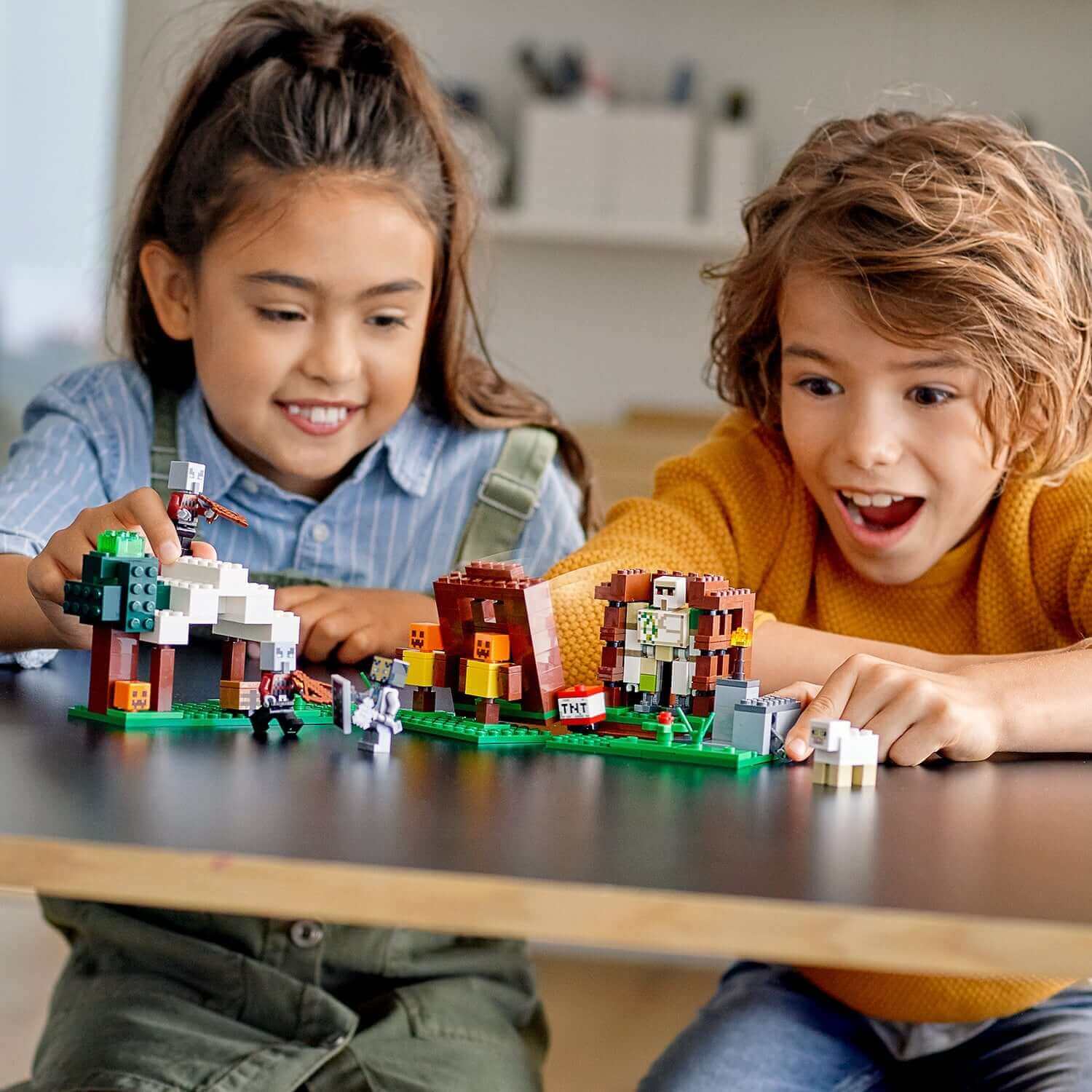 Children enjoying LEGO® Minecraft The Pillager Outpost Set 21159 with figures and creative play elements on a table.