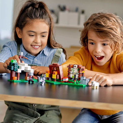 Children enjoying LEGO® Minecraft The Pillager Outpost Set 21159 with figures and creative play elements on a table.