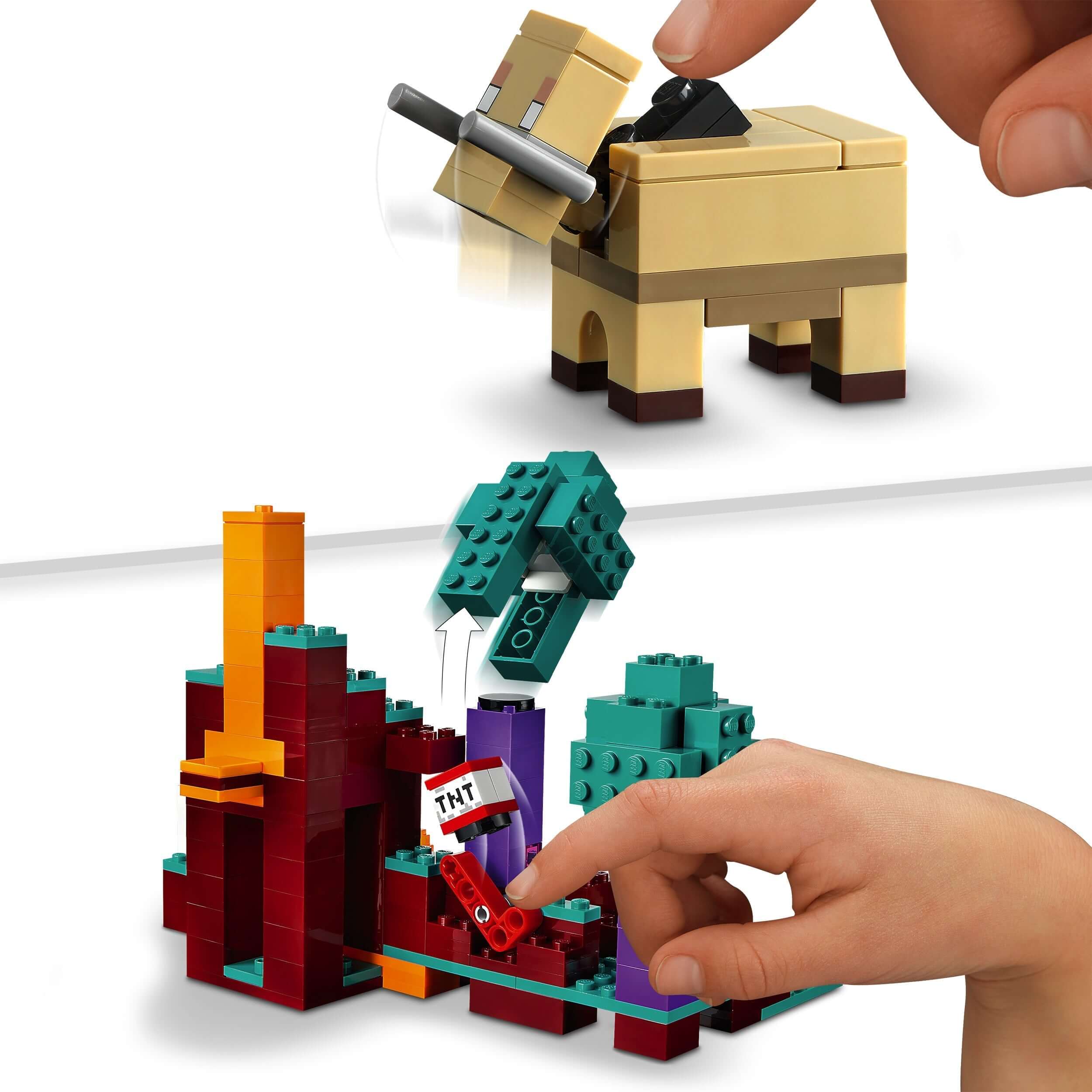 Child interacting with LEGO® Minecraft The Warped Forest toy, featuring a buildable mountain and TNT element.
