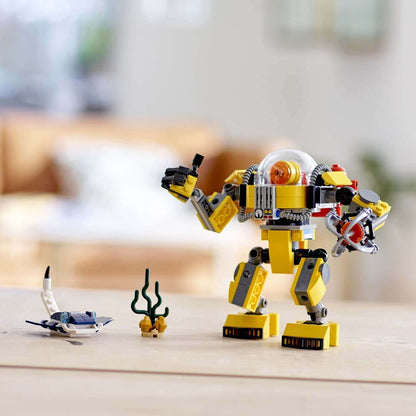 LEGO Creator 3in1 Underwater Robot Set 31090 features a yellow robot with accessories on a table.