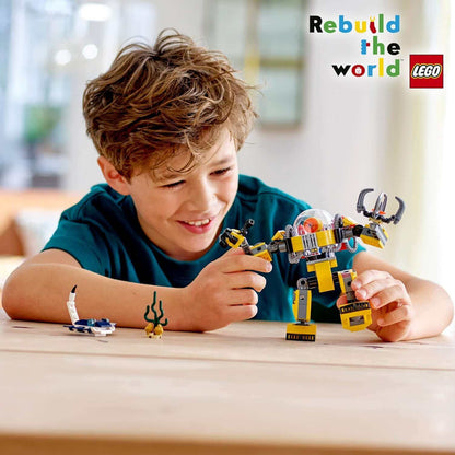 Child playing with LEGO® Creator 3in1 Underwater Robot Set 31090, showcasing creativity and fun.