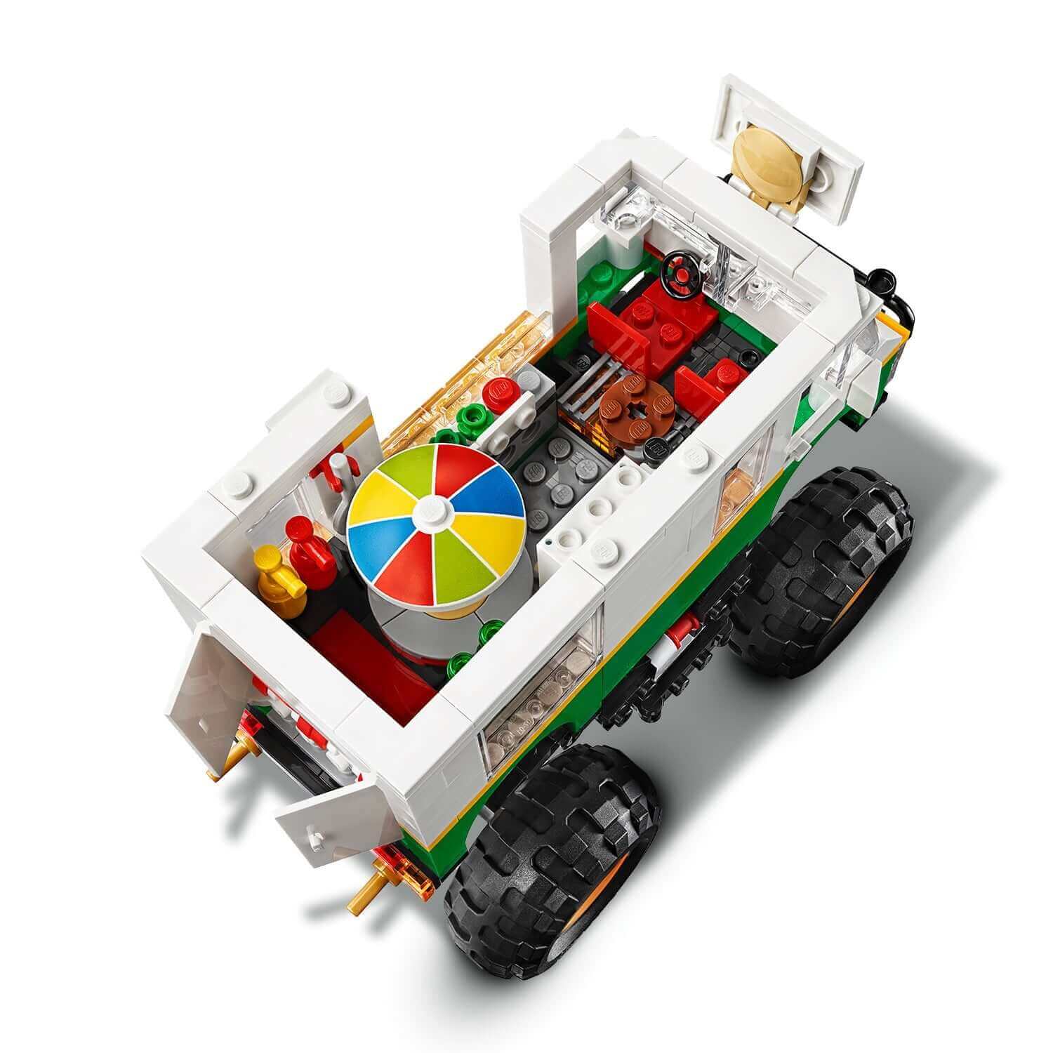 LEGO Creator 3in1 Monster Burger Truck Set 31104, showcasing the colorful interior with a burger stand and driver seat.