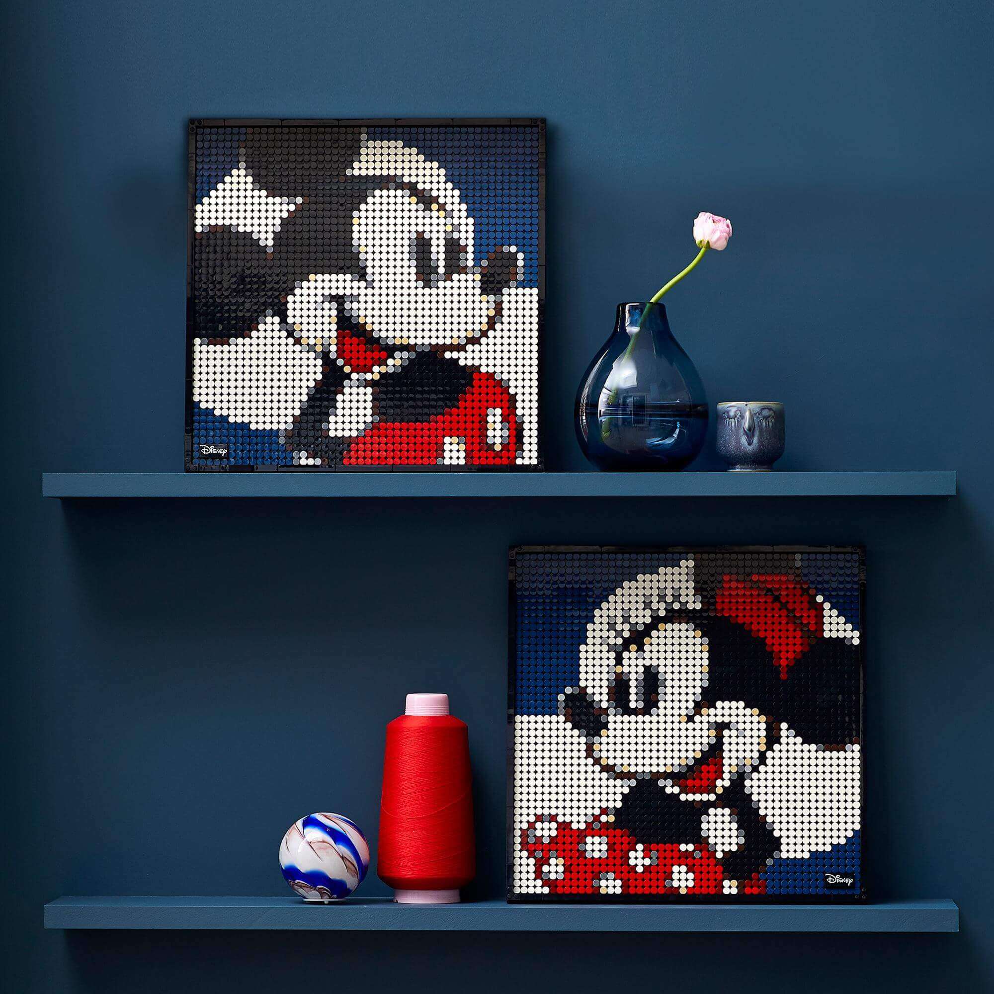 LEGO® Art Disney Mickey Mouse and Minnie Mouse wall art displayed on blue shelves with decorative items.