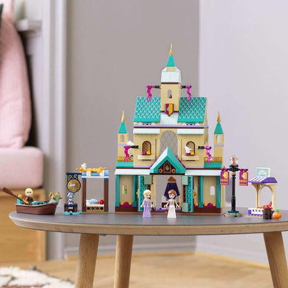 LEGO Disney Frozen 2 Arendelle Castle Village set with Anna and Elsa figures on a table.