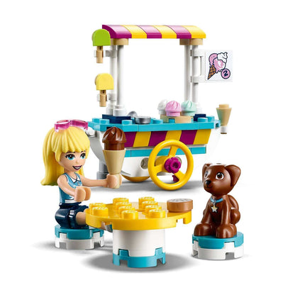 LEGO® Friends Ice Cream Cart Set 41389 with a girl, ice cream cones, and a dog, perfect for imaginative play.