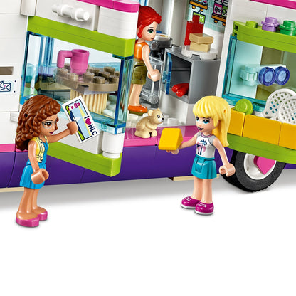 LEGO Friends Friendship Bus playset featuring kids playing and a cute puppy, promoting creative fun and adventure.