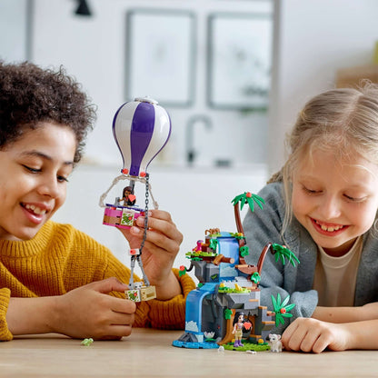 Kids enjoying LEGO Friends Tiger Balloon Jungle Rescue Set 41423 with balloon and jungle playset, promoting wildlife exploration.